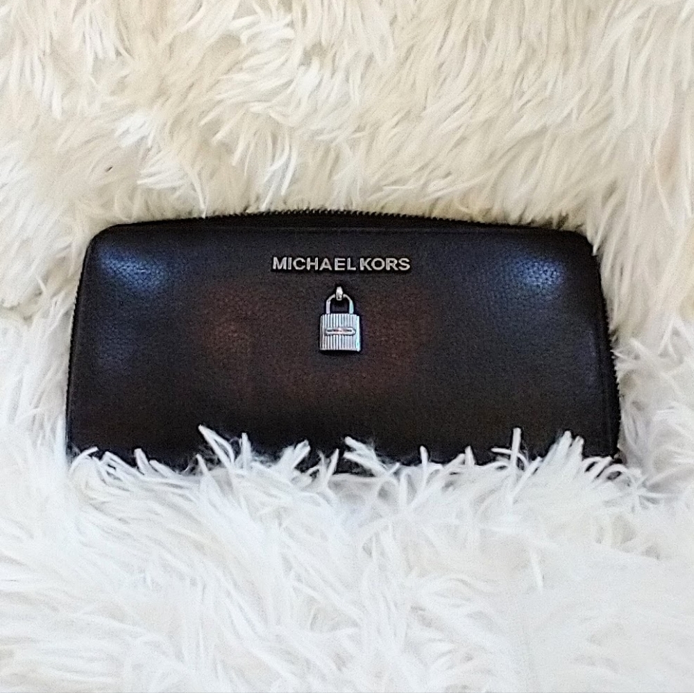 Michael kors Black Leather zip around wallet. Adele Limited pad lock collection